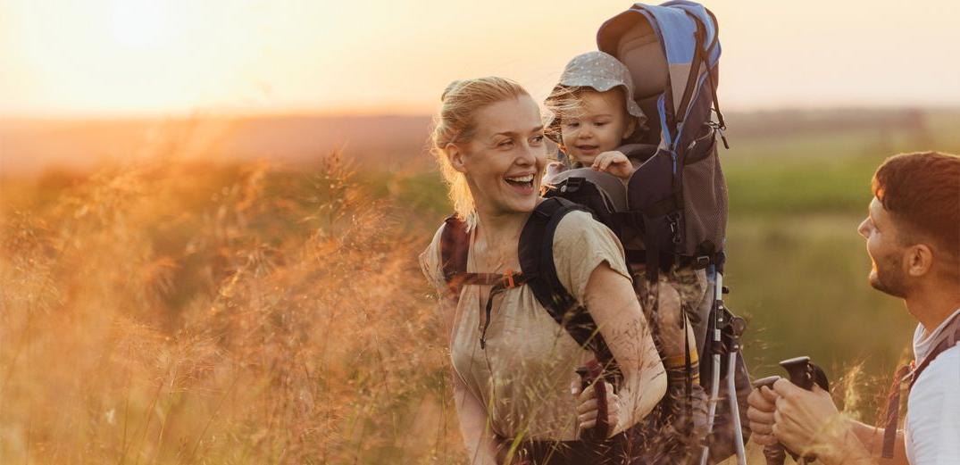 A young family takes a late afternoon hike in California.