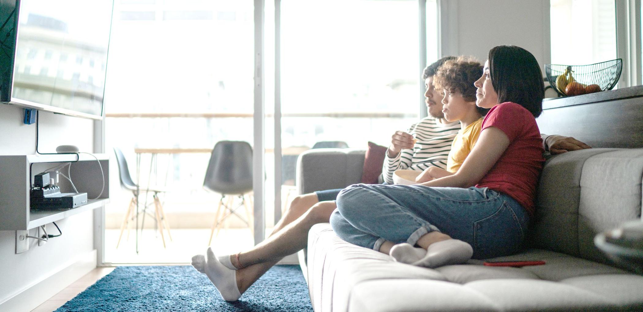 A family watches television at home.