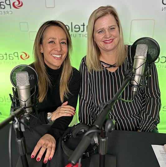 Patelco employees Michele Enriquez and Jennifer Mink at the podcask desk